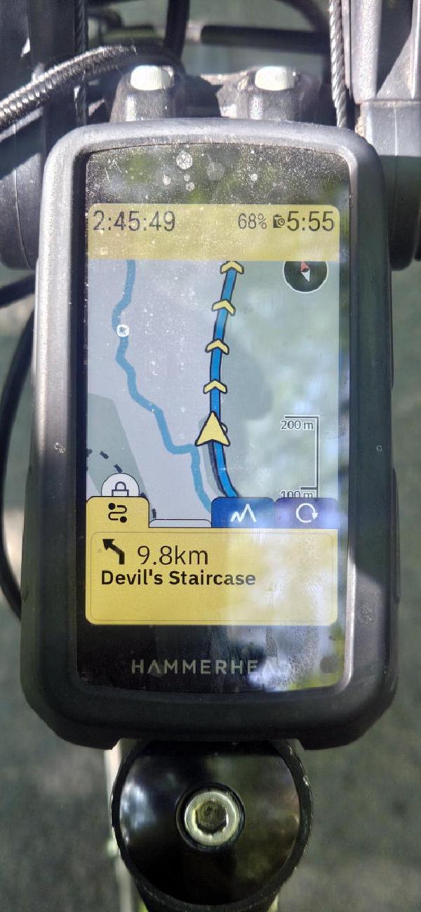 Hammerhead cycling computer mounted on handlebars displaying 9.8km to the Devil’s Staircase