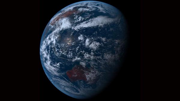 Natural-colour satellite view of Earth showing the sunlit Asia–Pacific region with Australia at the lower edge, surrounded by deep blue oceans and swirling white clouds against the blackness of space.